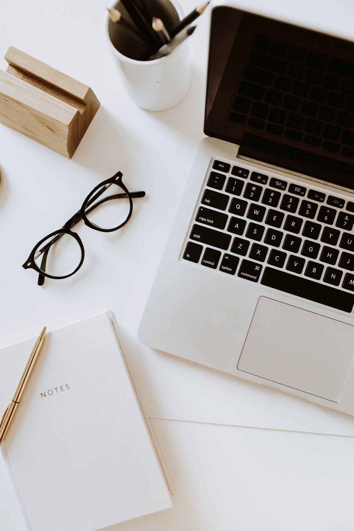 Laptop on White Modern Minimalist Office Desk Flatlay